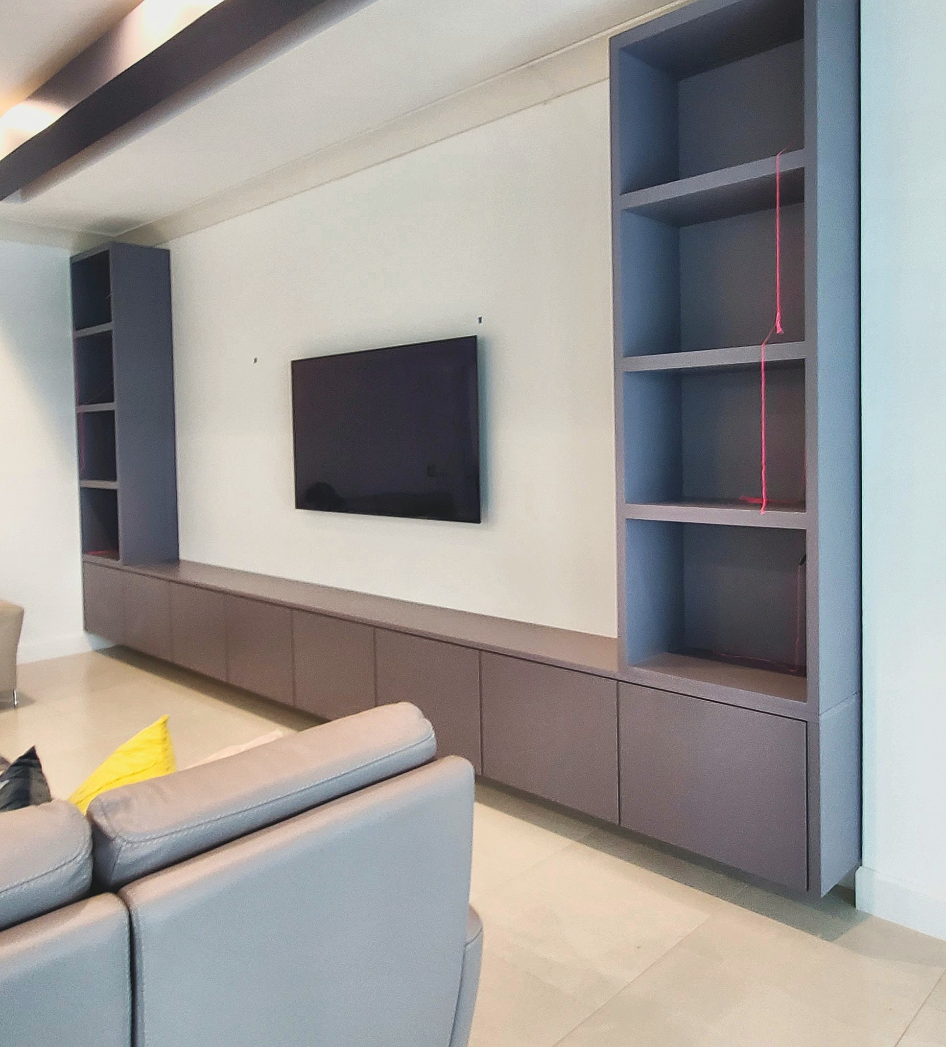 Grey media wall with shelves